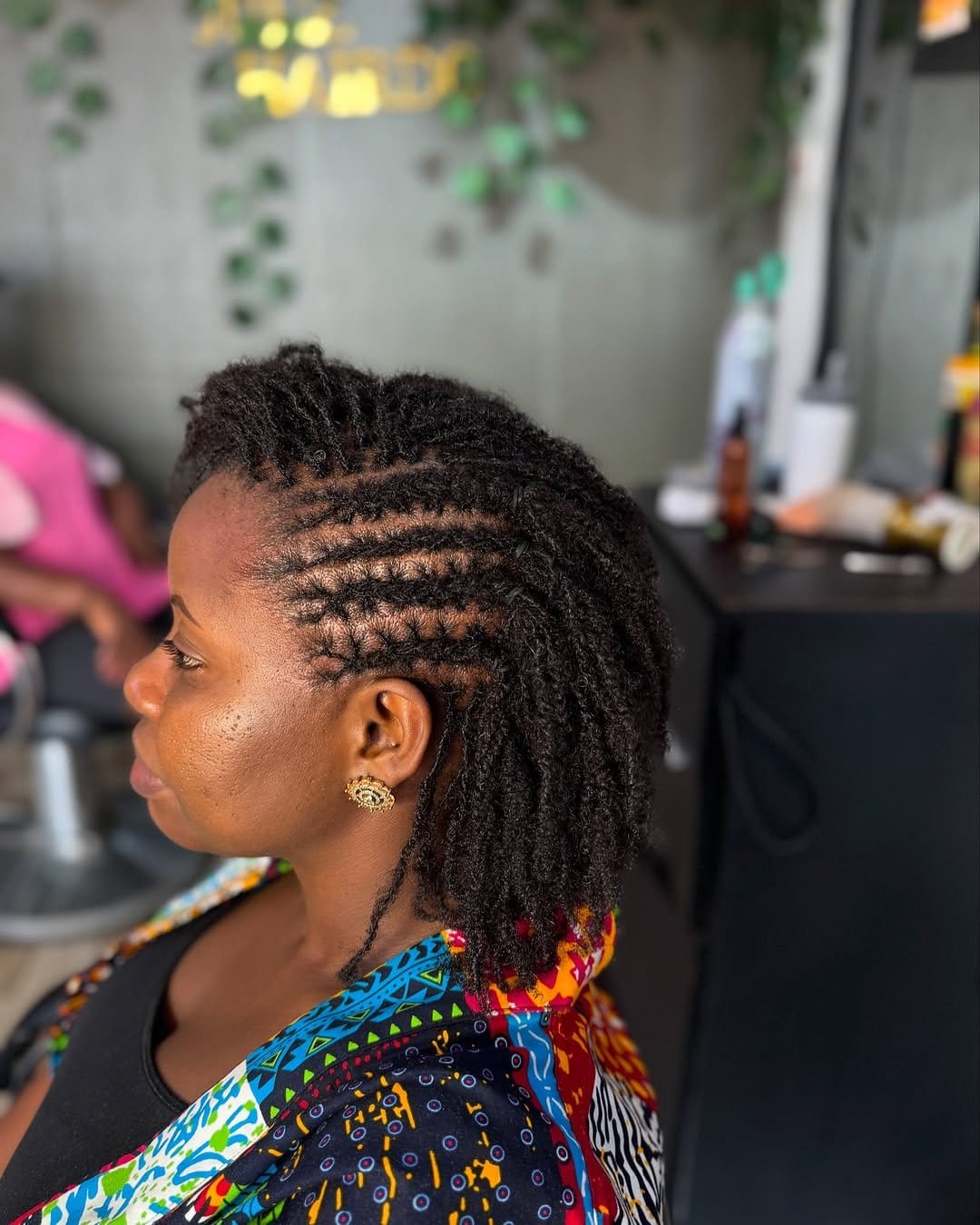 Classic short dreadlocks on urban backdrop
