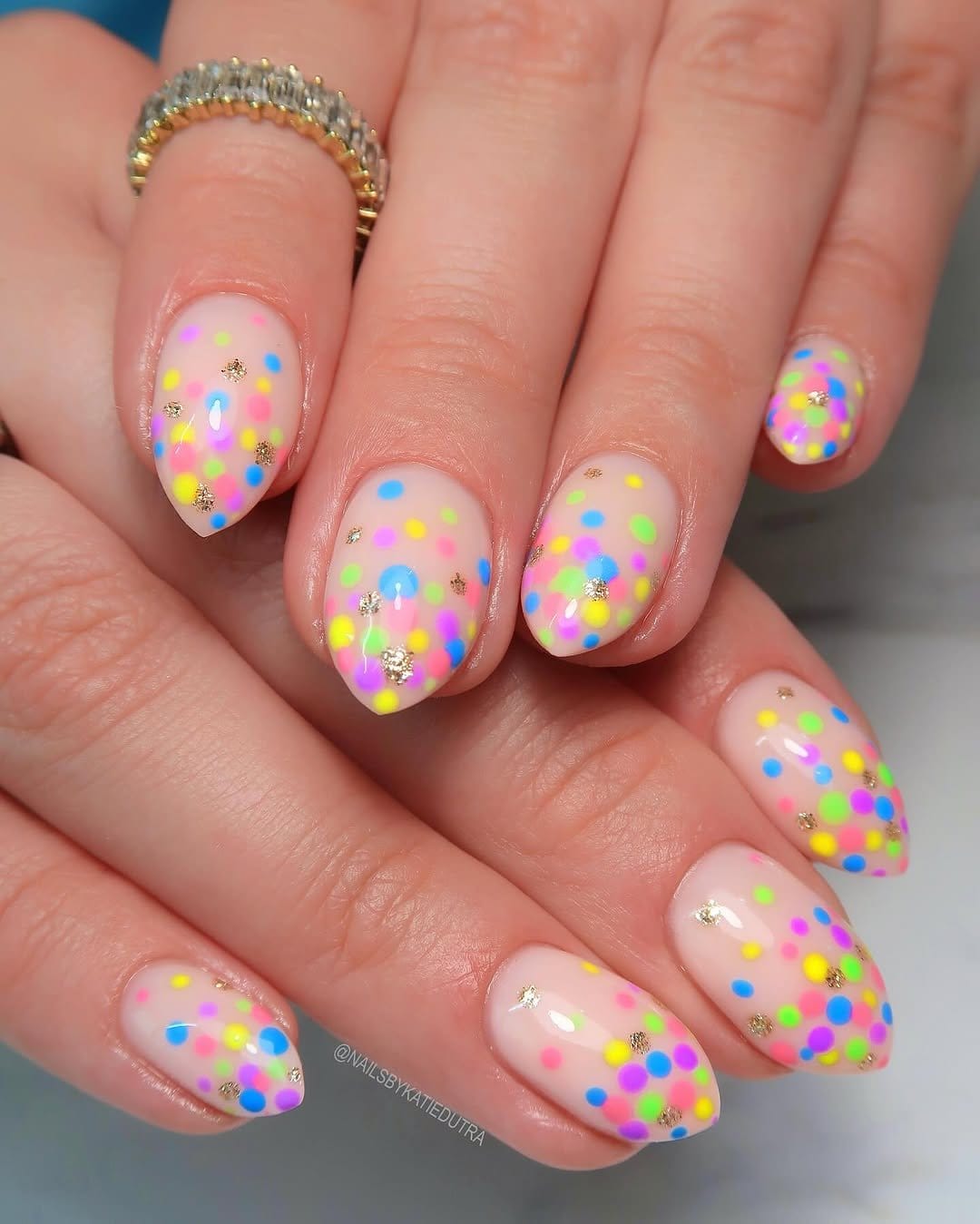 Nails with colorful confetti dots