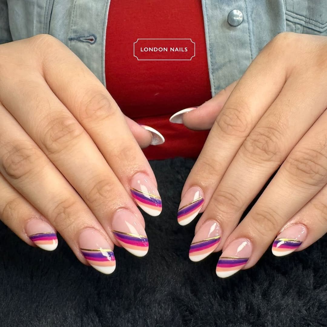 Lavender nails with gold stripe accents