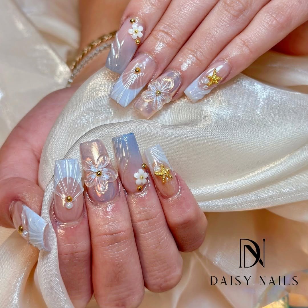 Close-up of nails with daisy accents