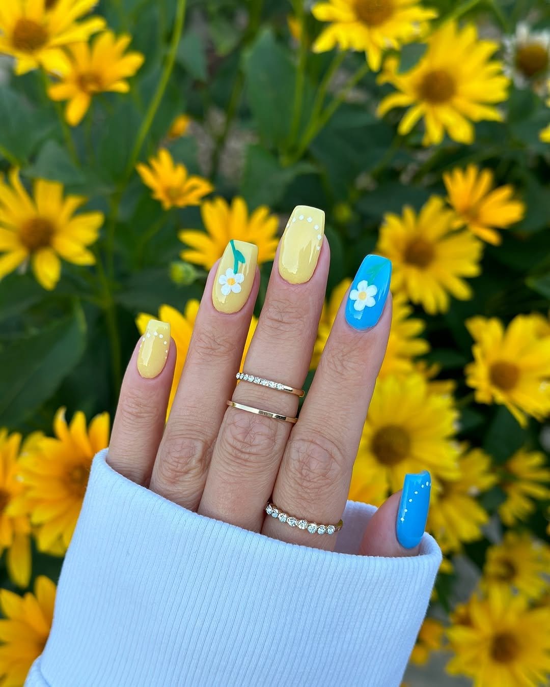 Vibrant sunshine yellow French tips with smiley face accent