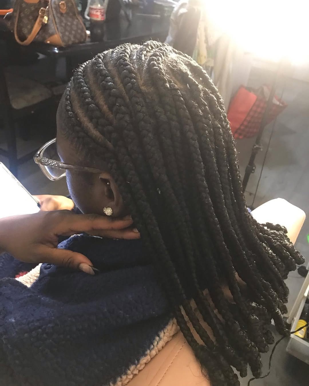 Colorful short locs styled into Bantu knots