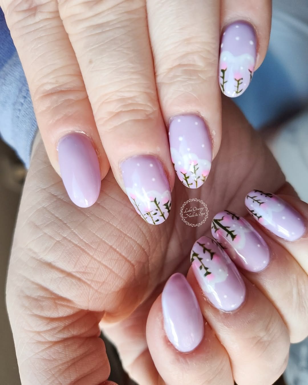 Delicate pastel lilac ombre nails with lilac flowers