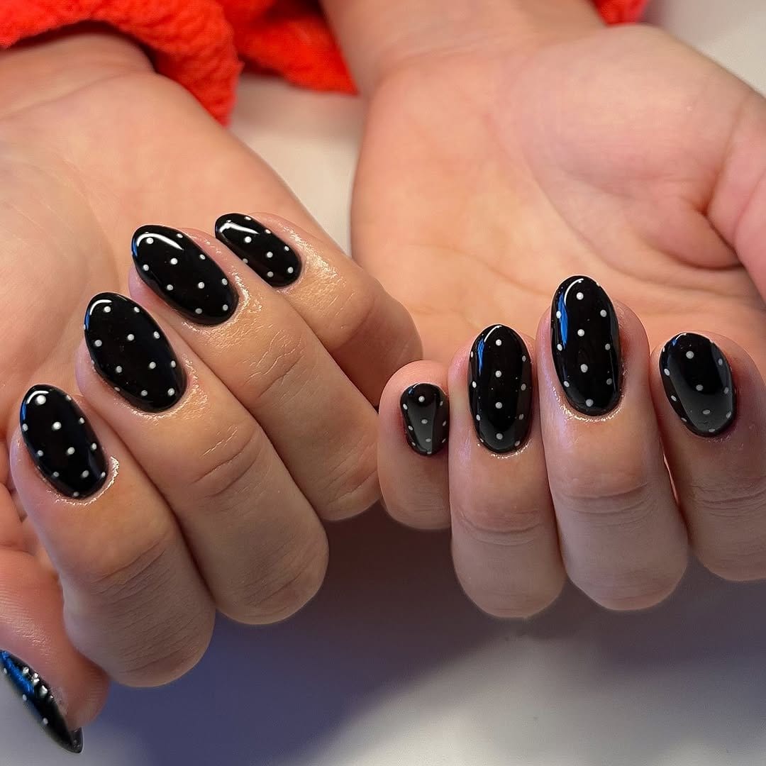 White polka dot nail design