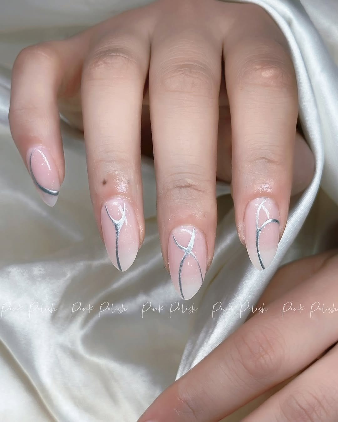 Simple hot pink nails with thin black lines