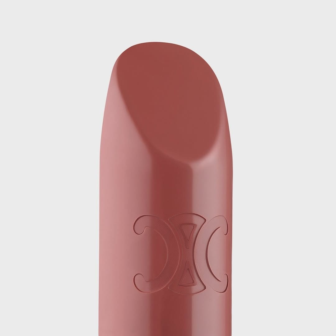 Timeless red lipstick tube on white background
