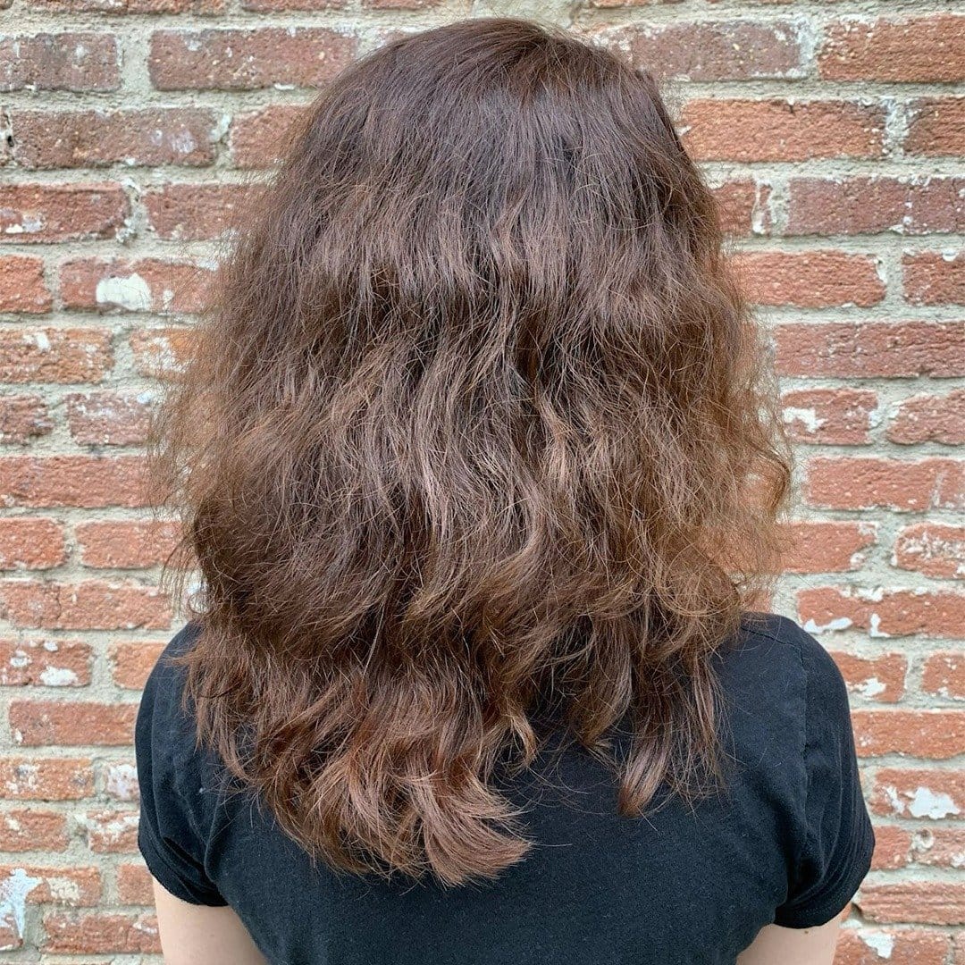 Short dreadlocks styled into tight ringlets