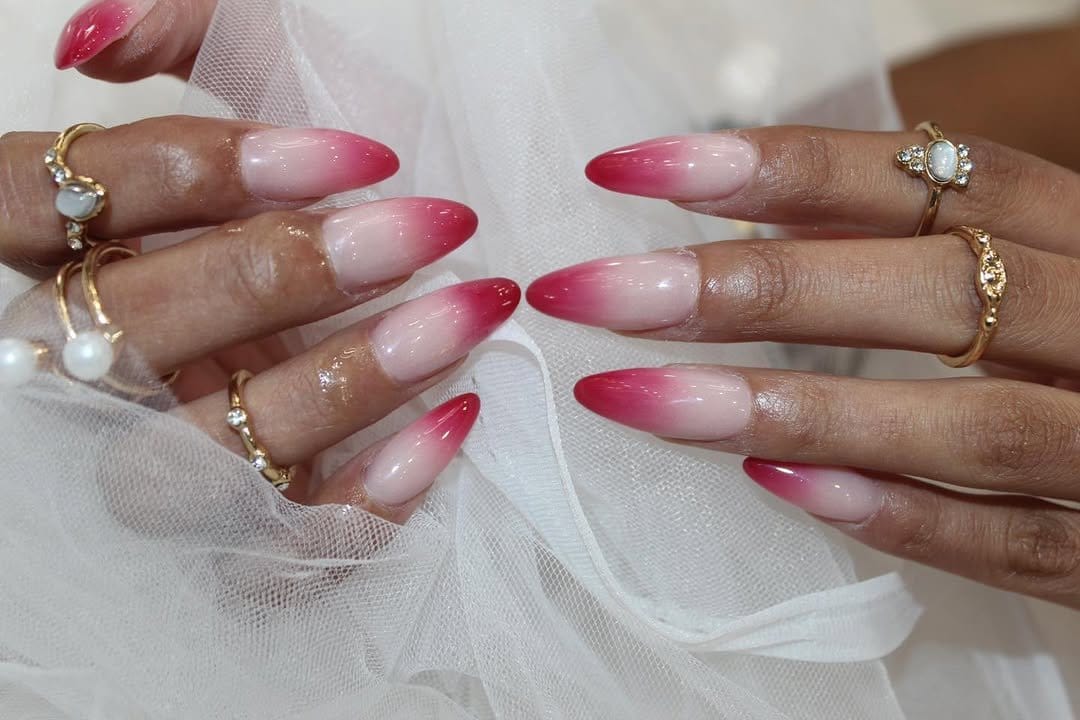 Subtle red ombre nails with a nude base