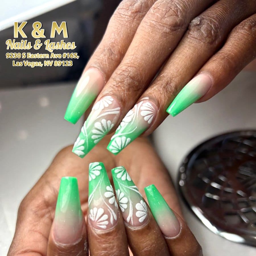 Mint green pastel nails with floral accents