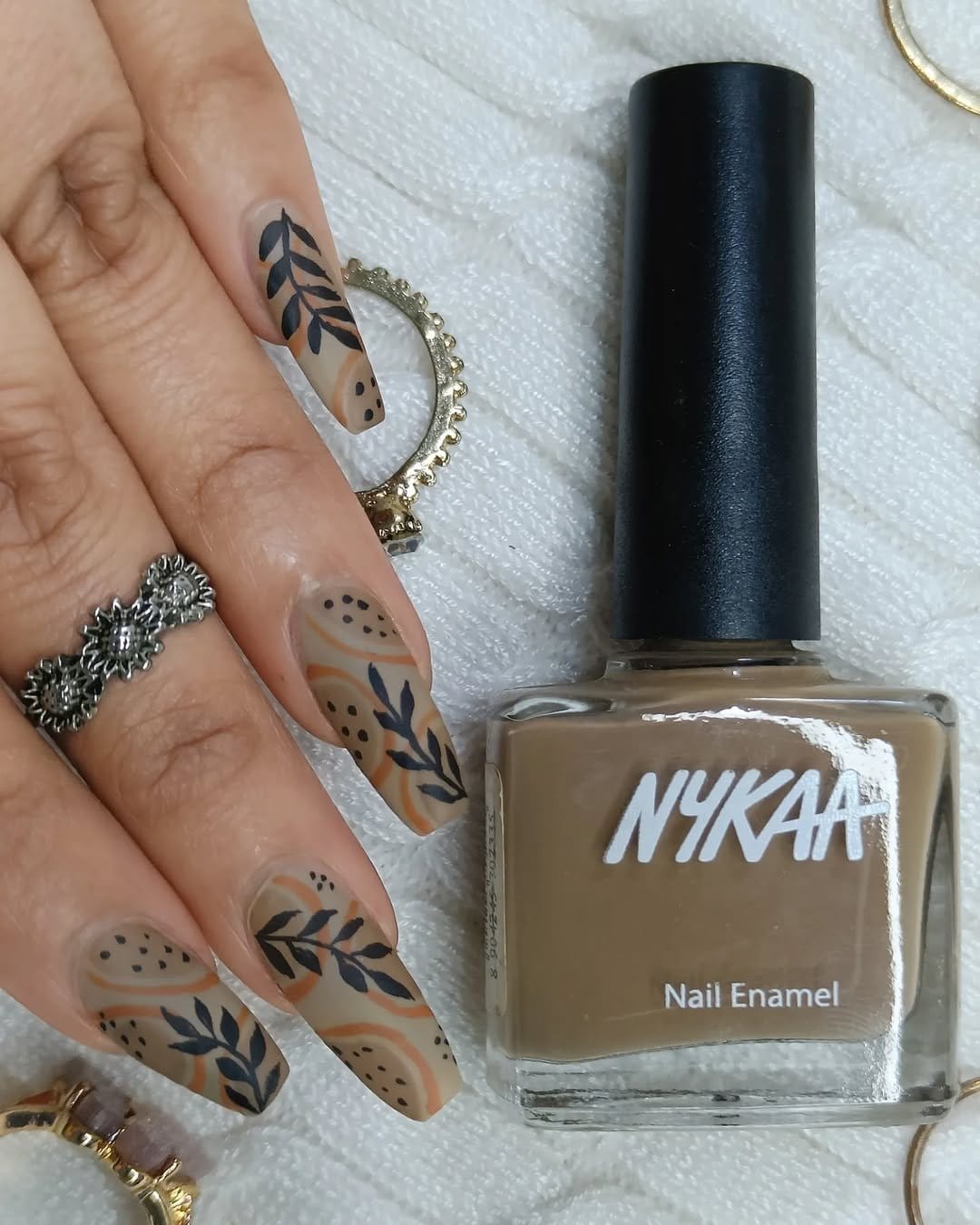 Soft neutral tone nails with a matte finish