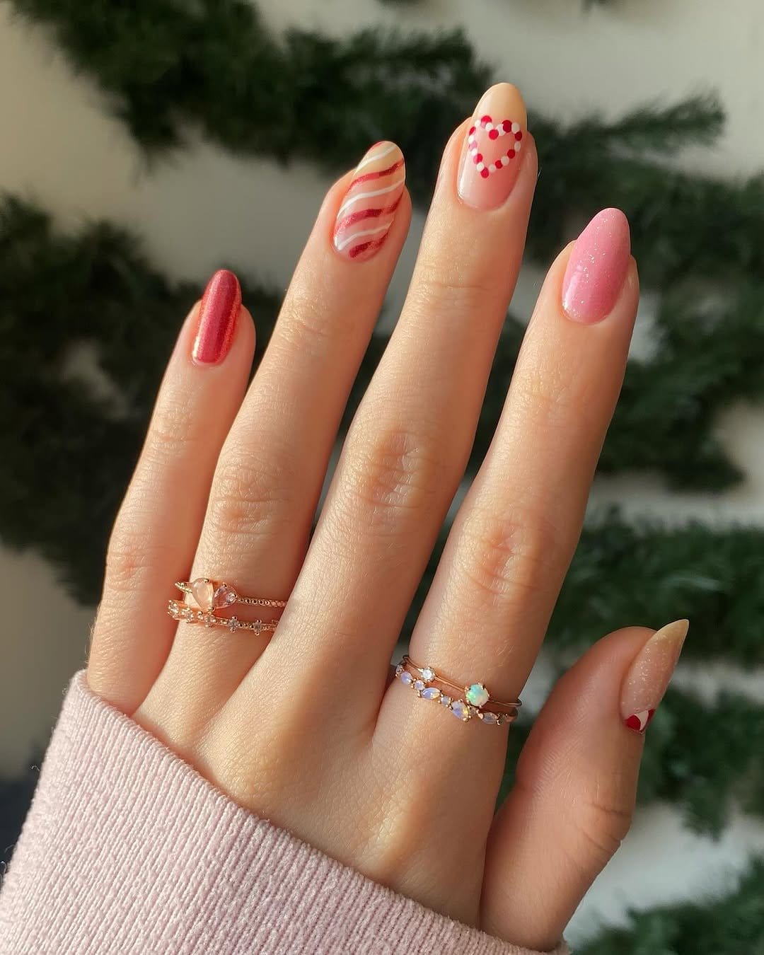 Fun pastel bubblegum pink ombre nails with candy backdrop
