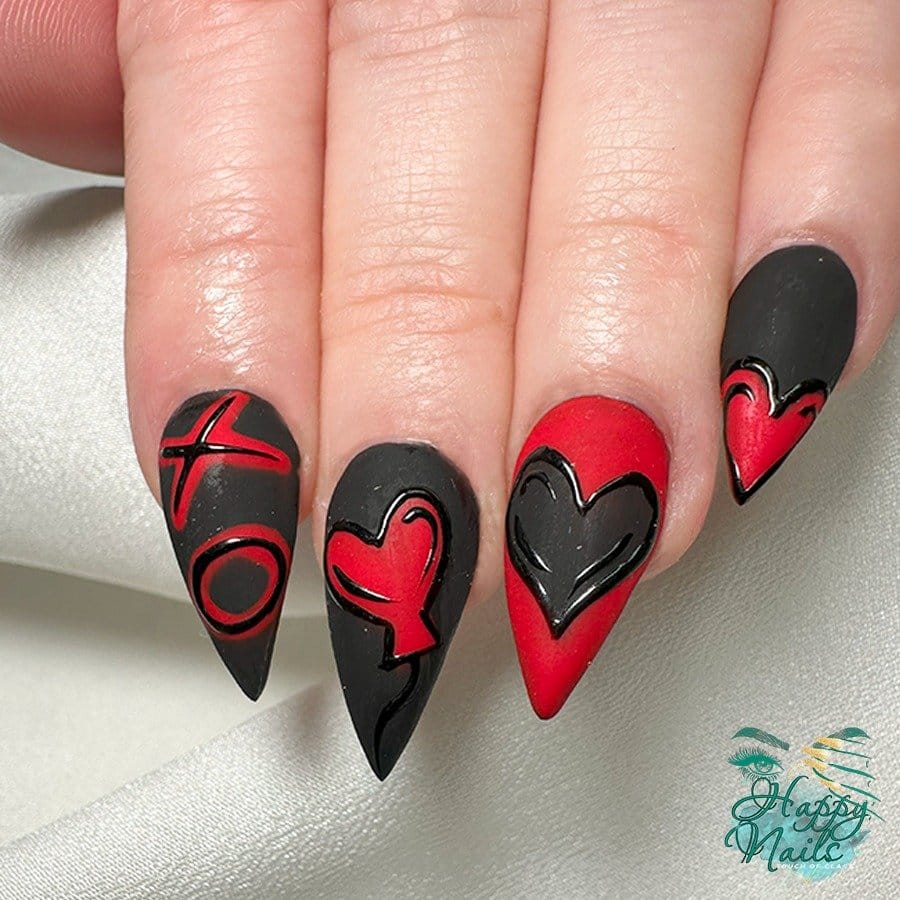Bold pastel pink and black contrasted nails