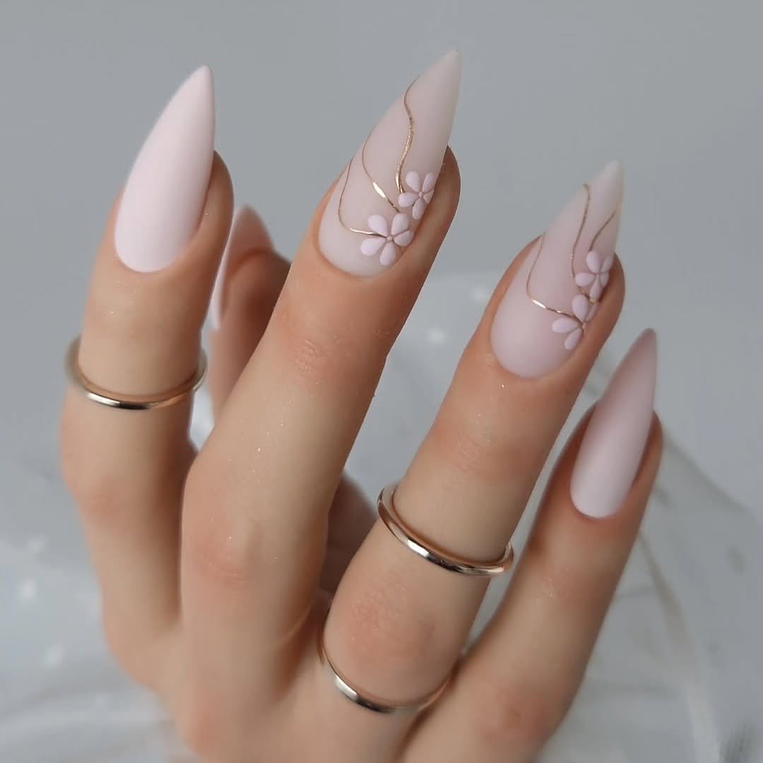 Soft coral nails with pearl embellishments