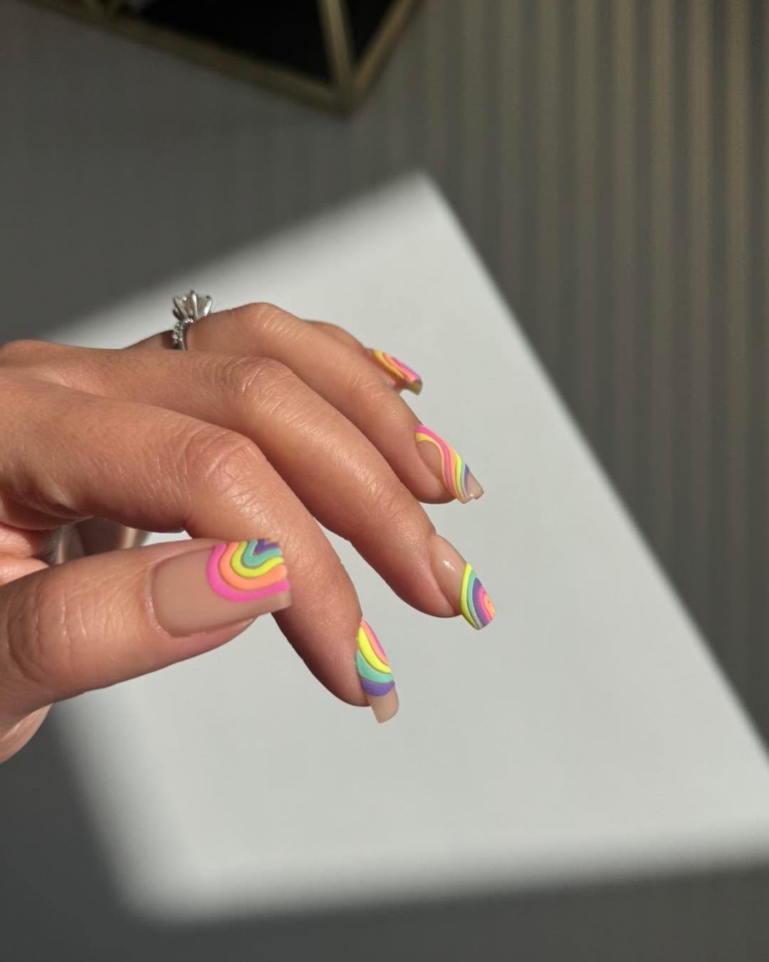 Vibrant rainbow striped nails