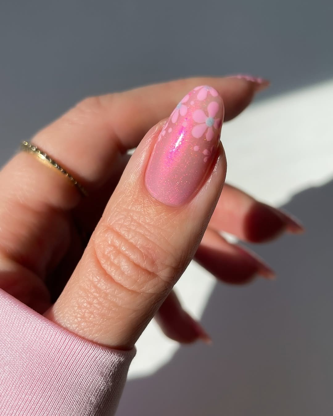 Snapdragon flower nail art on a pale pink nail