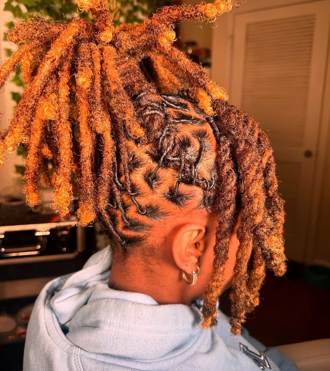 Elegant cinnamon roll updo with short dreads