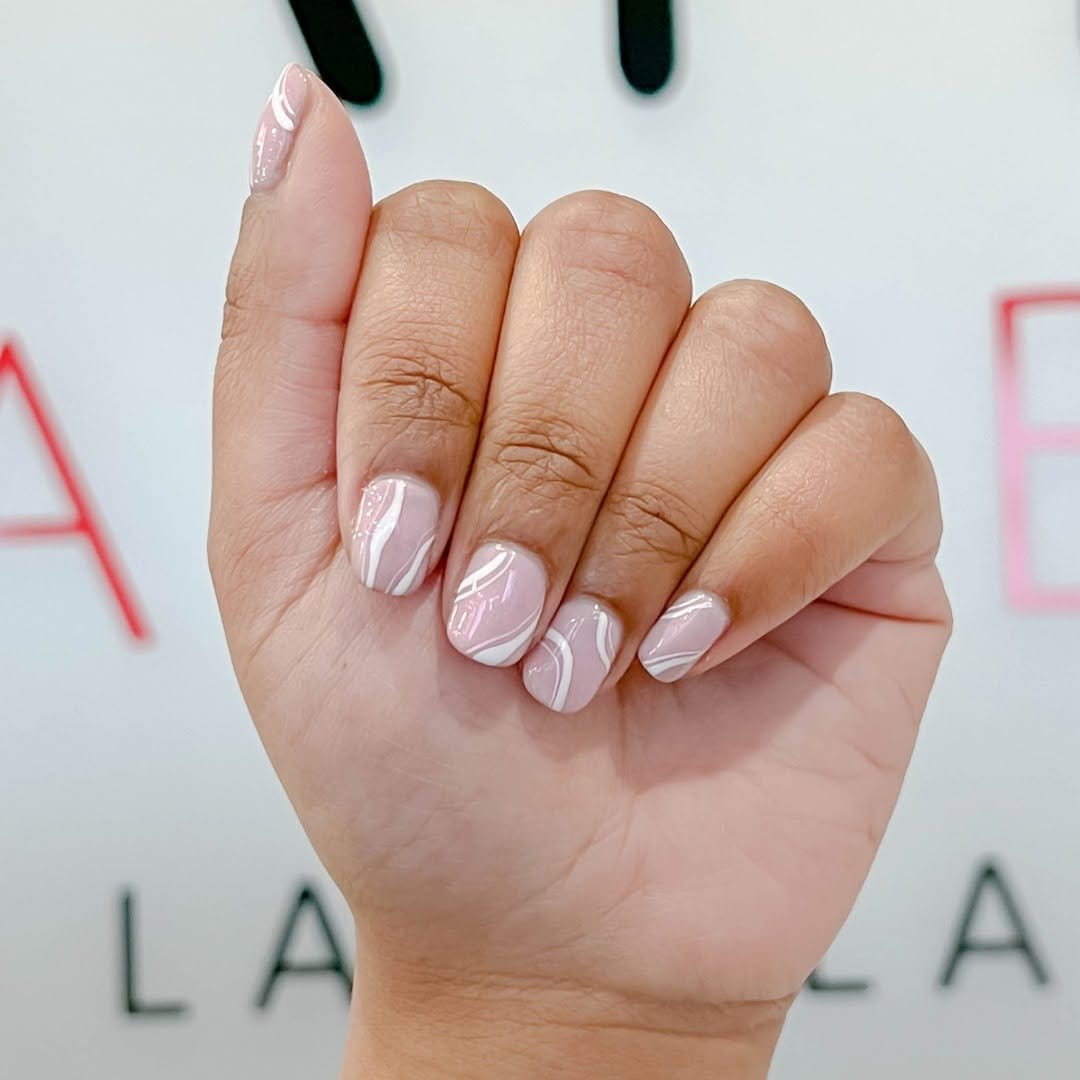 White nails with beige minimalist accents