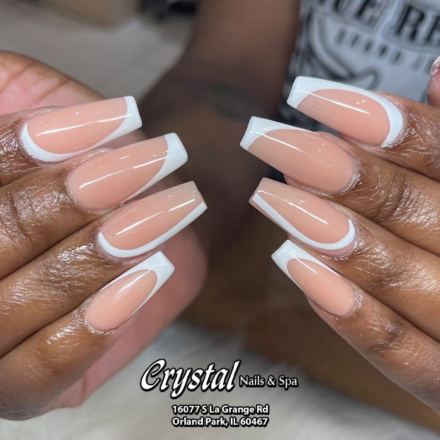 White nails with glitter crystal embellishments