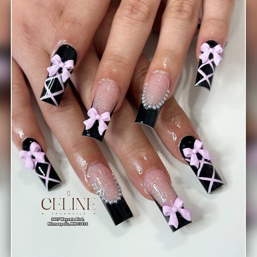 Light pink nails with black accents