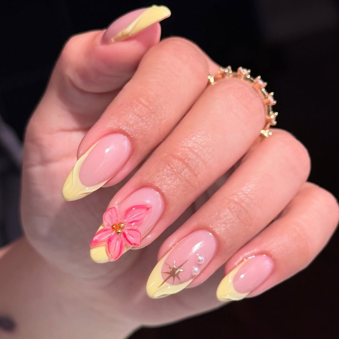 Soft yellow nails with lace overlay