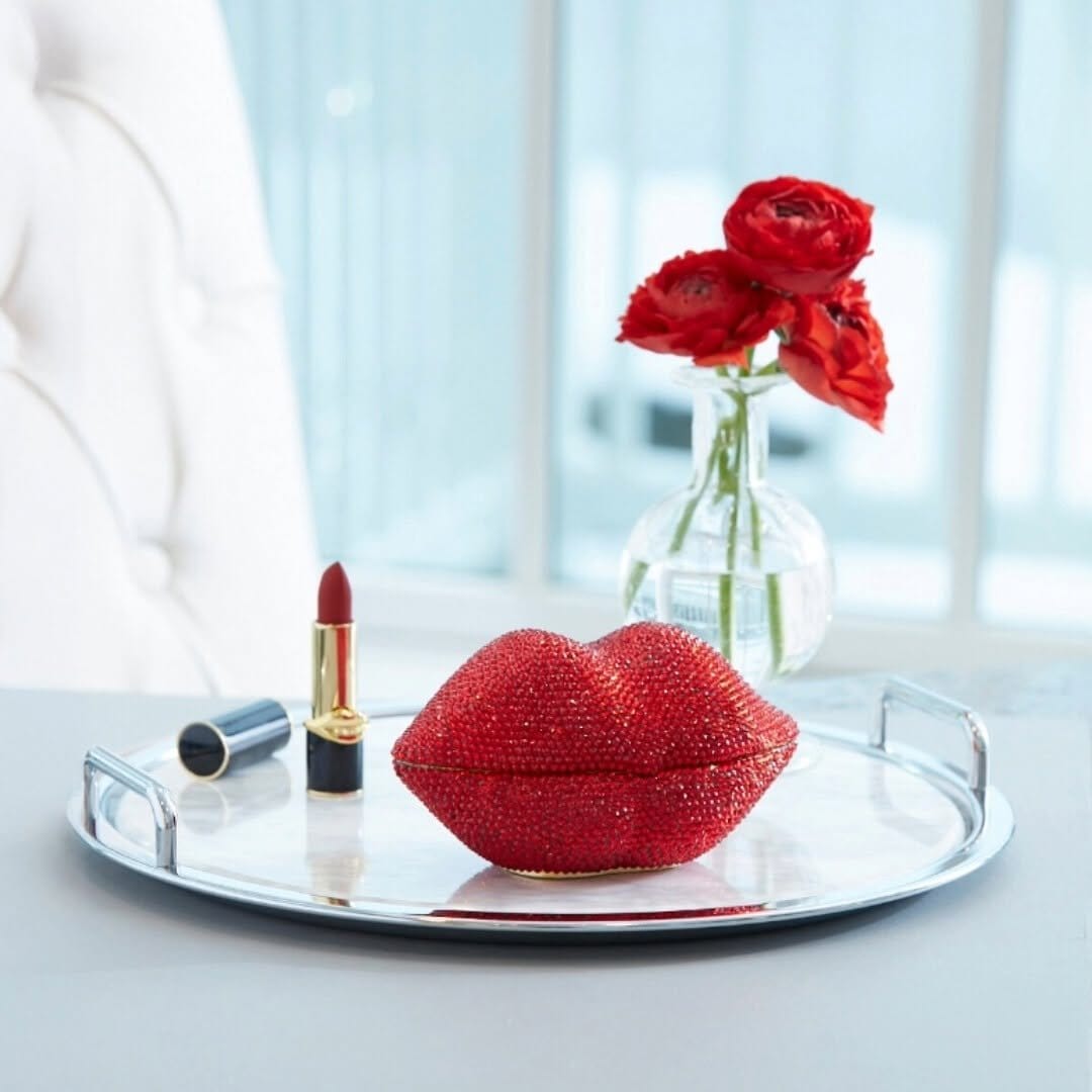Bright coral lipstick with floral accents