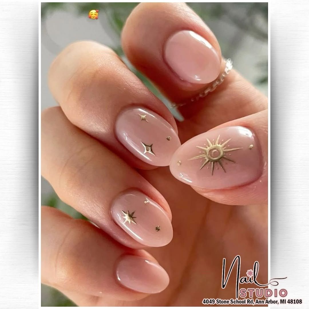 Subtle moon design on nude nails
