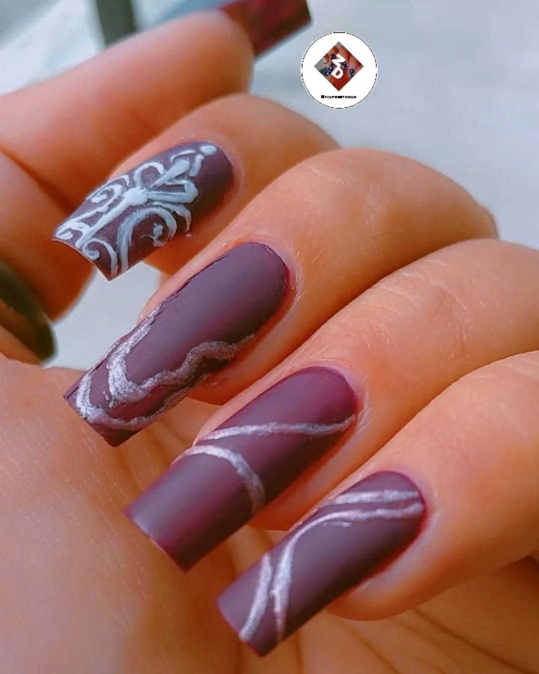 Mauve-colored nails with matte finish