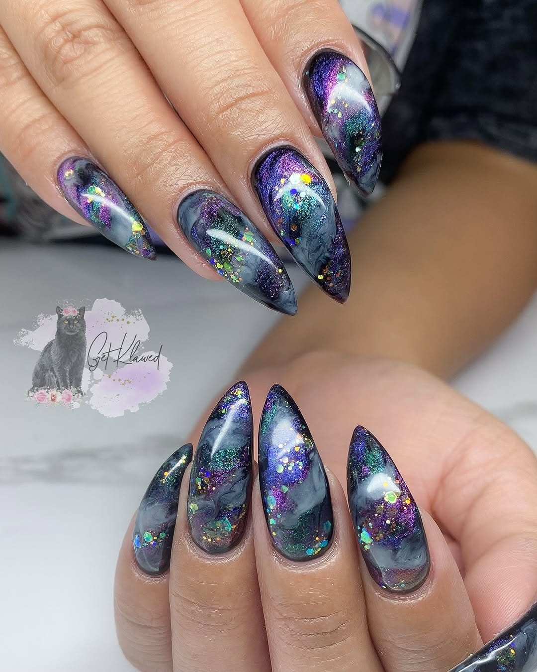 Cosmic white pastel galaxy nails