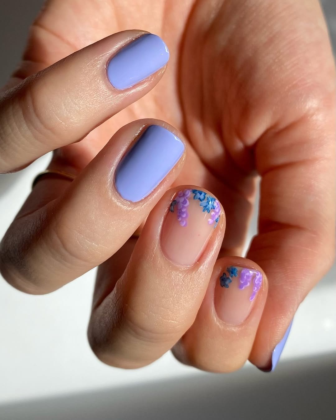 Bluebell flowers on a soft blue nail