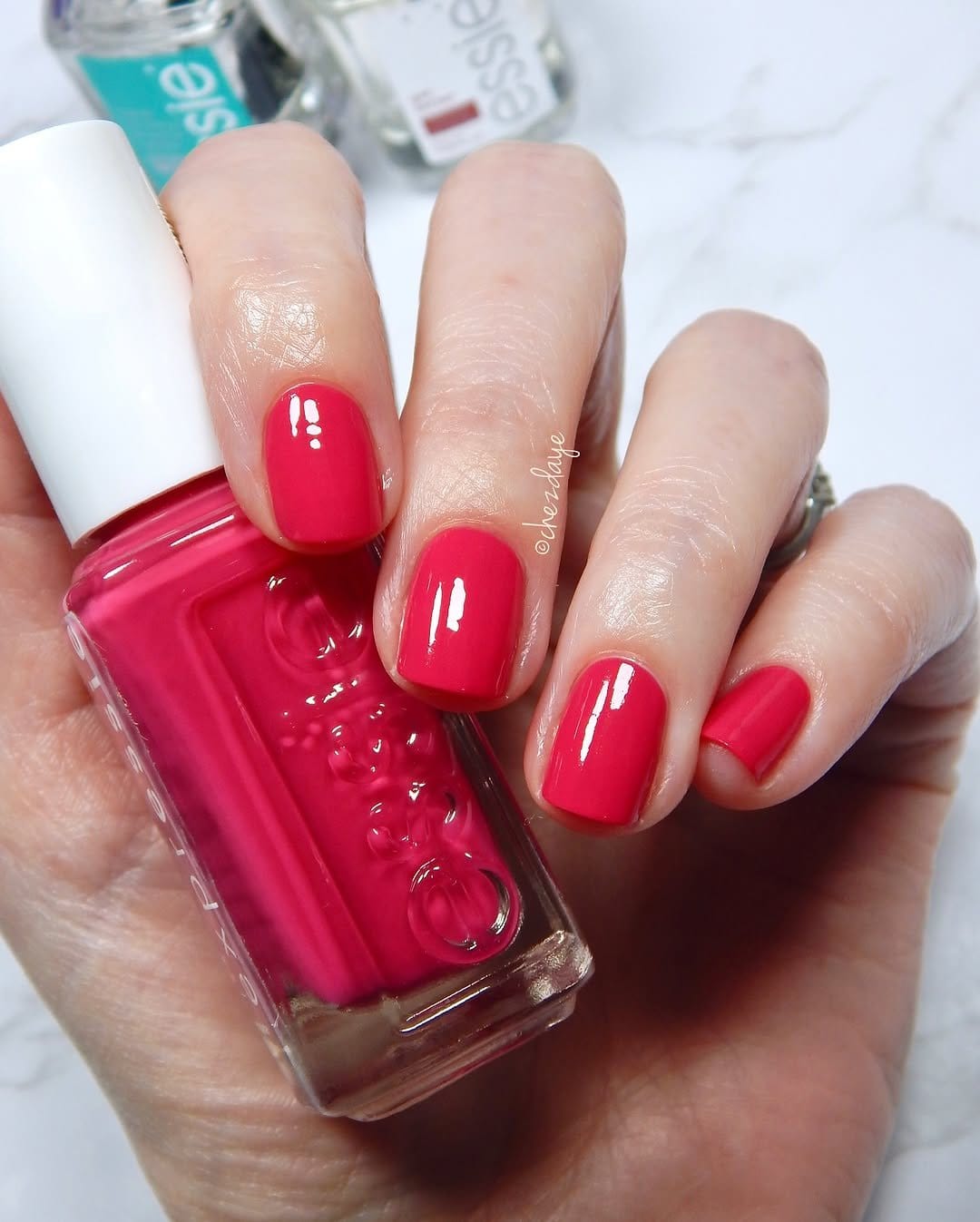 Vibrant hot pink nail polish bottle