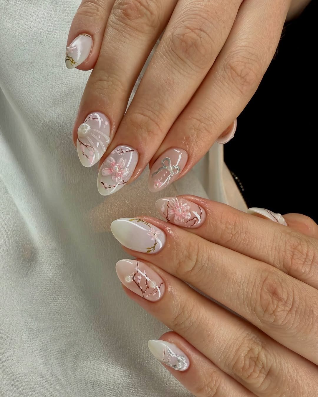 White nails with intricate floral designs
