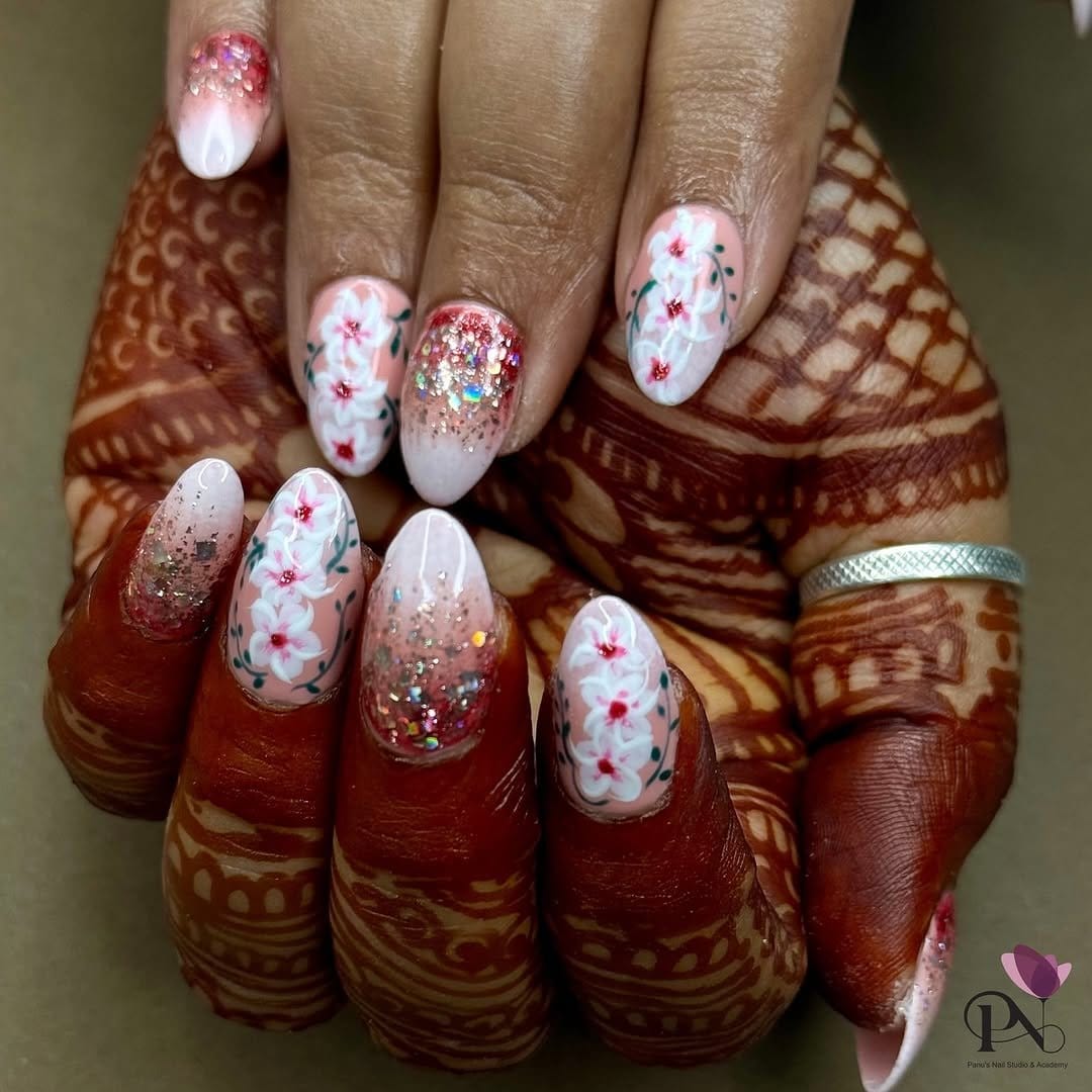 Pink glitter and floral nail art design