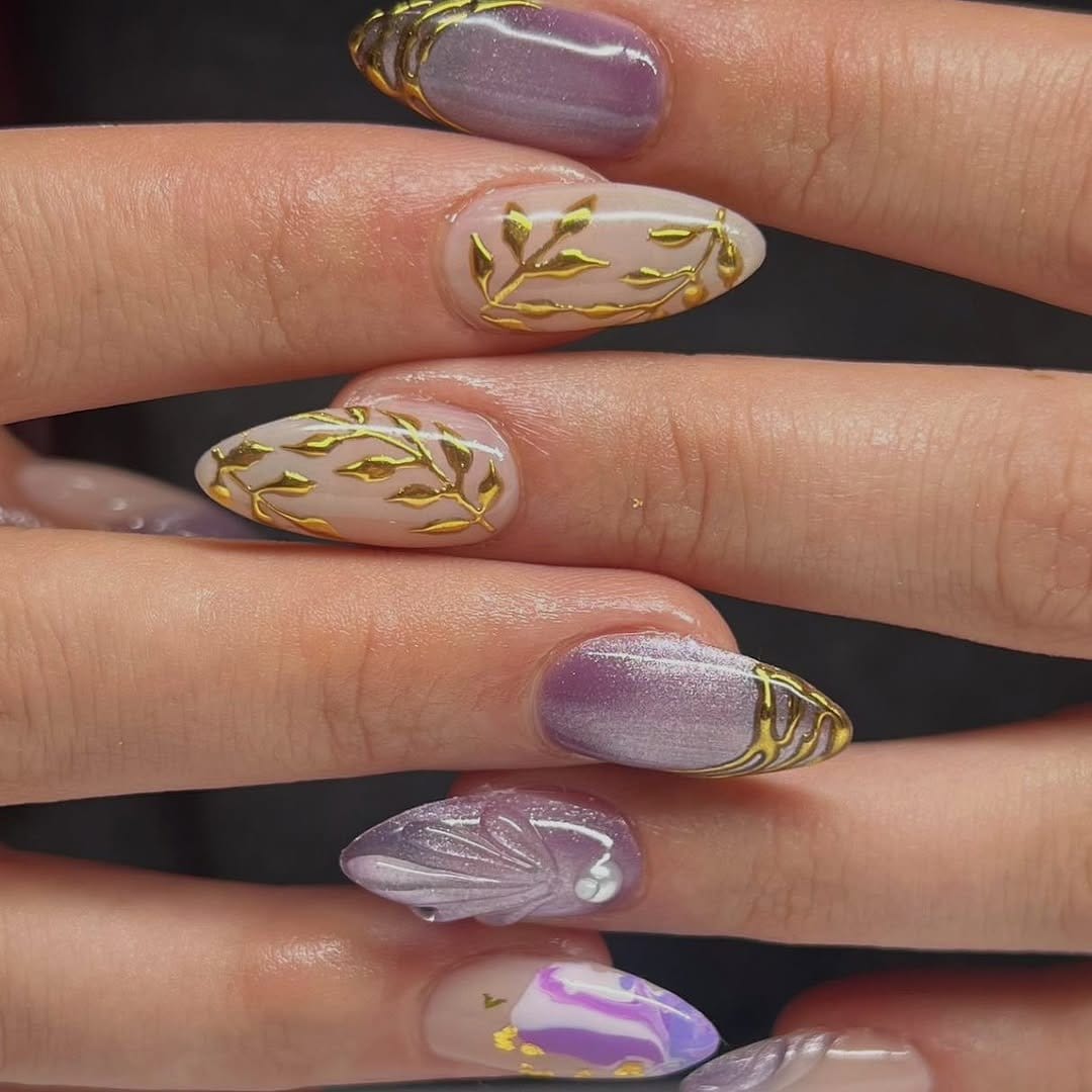 Lilac pastel nails with gold foil accents