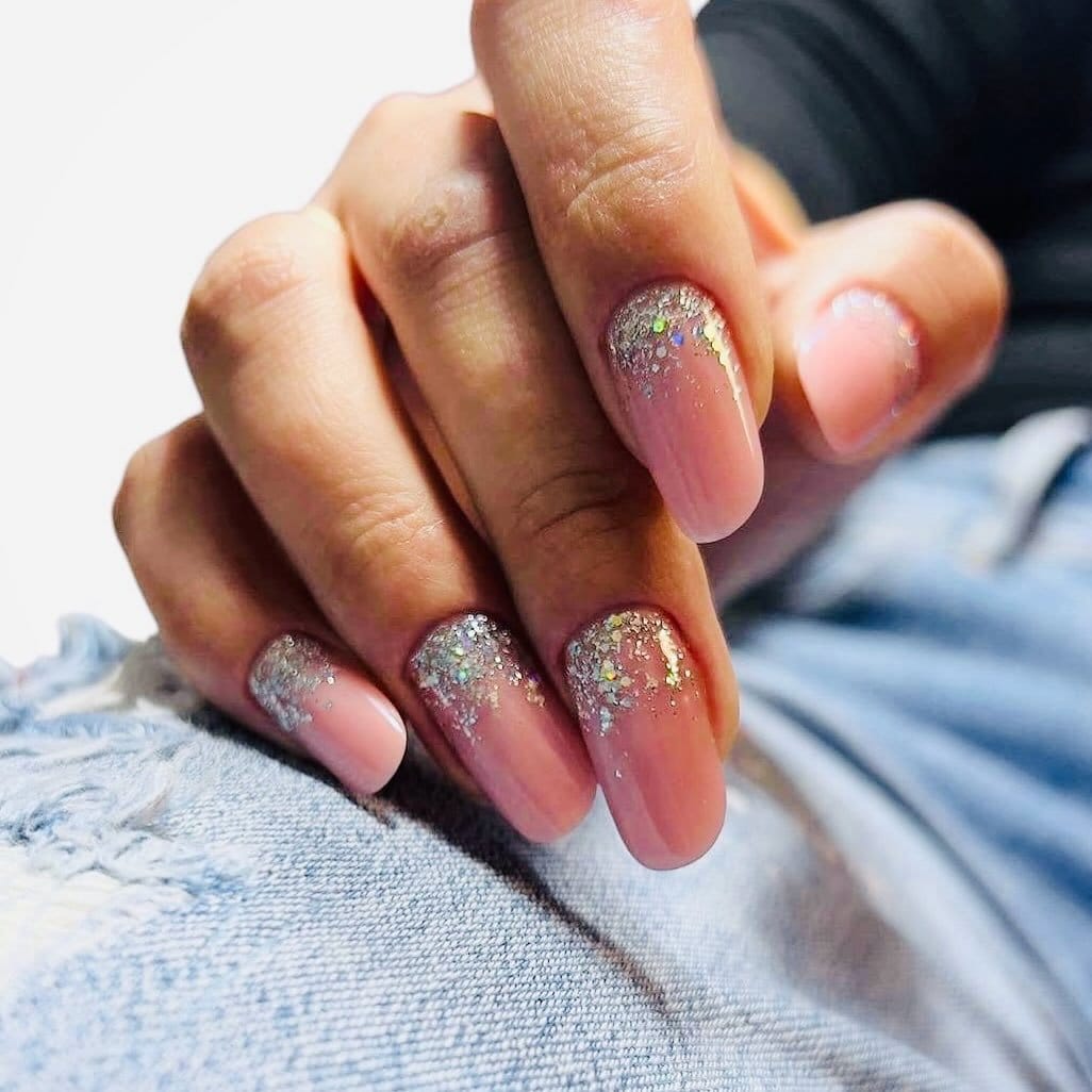 Glittery pink ombre nails with sparkles
