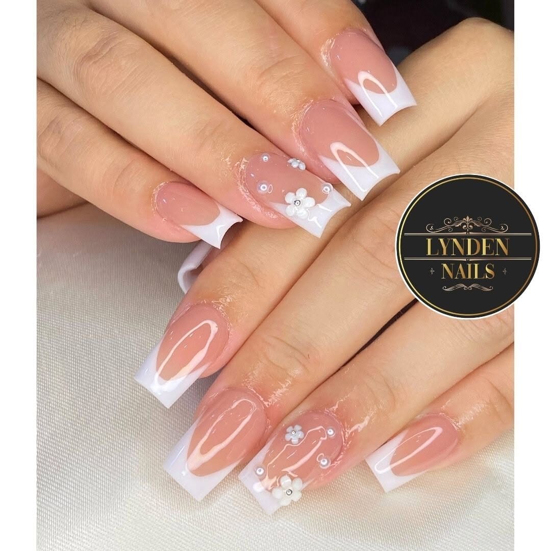 French tips with pastel dot patterns on clear base