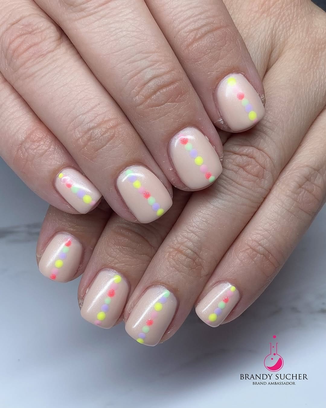 Colorful pastel confetti French tips with white base