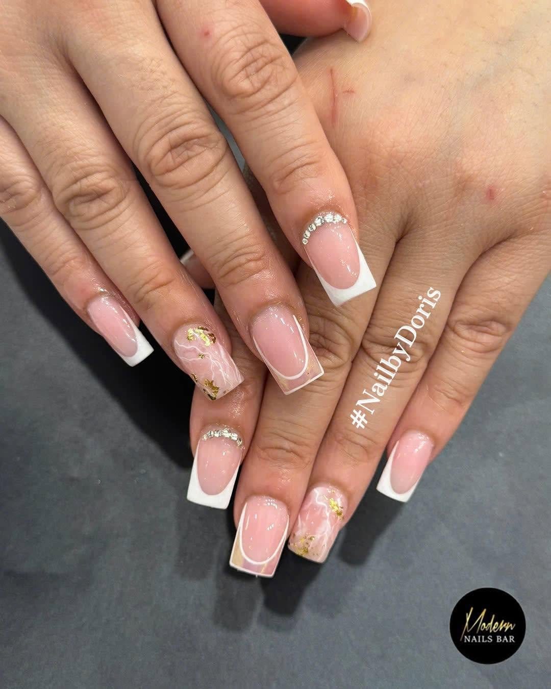 White nails with gold foil accents