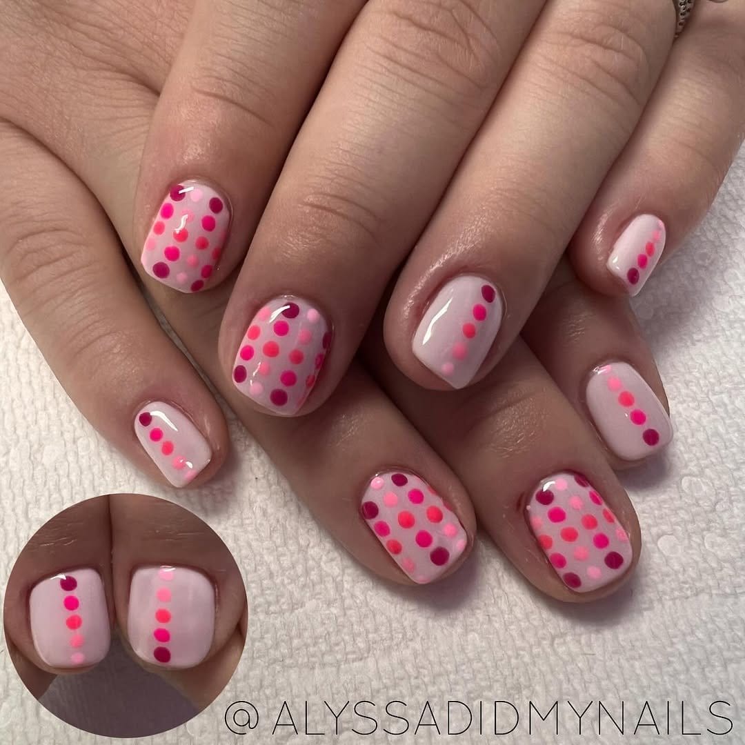 Pink ombre nails with polka dots