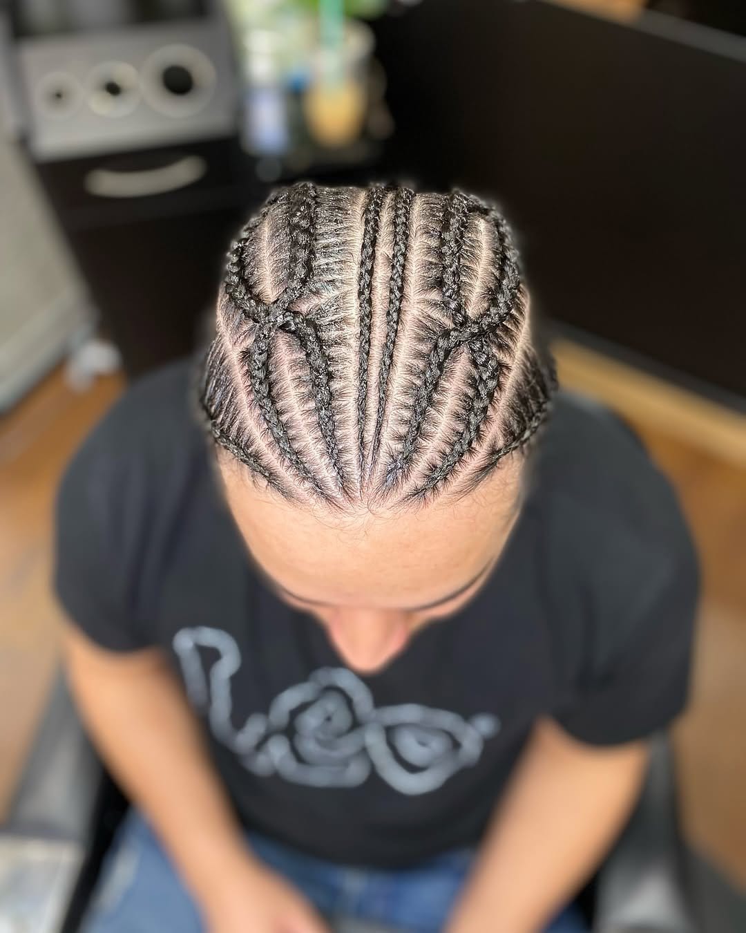 Intricate spiral pattern on short dreadlocks