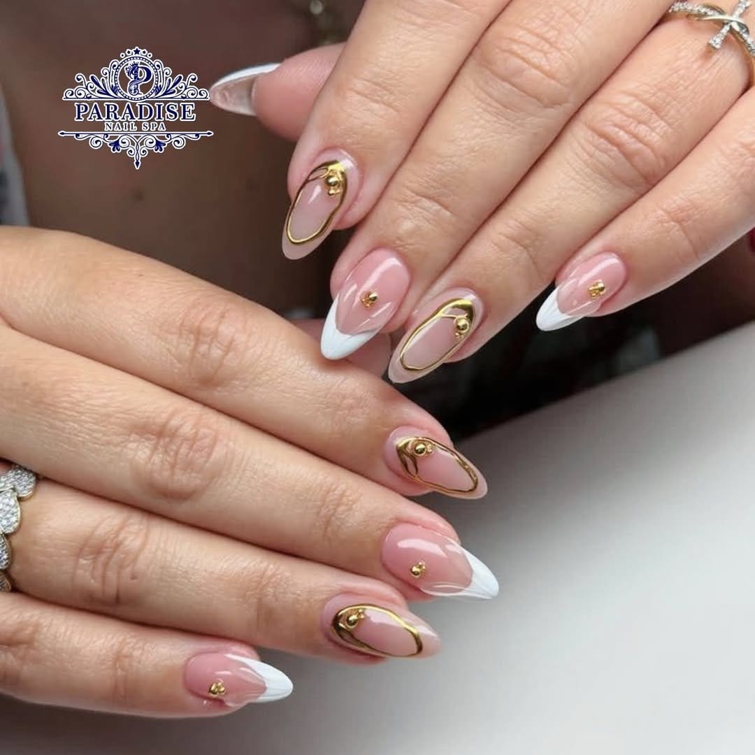 Gold accent lines on pale pink nails