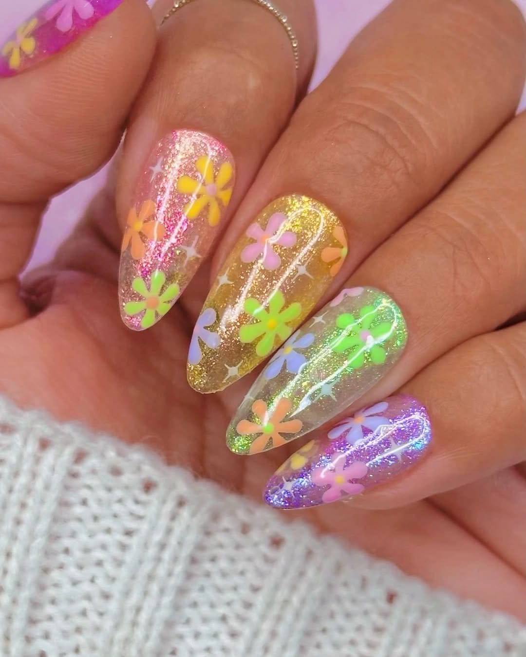Pastel tangerine nails with gold flecks