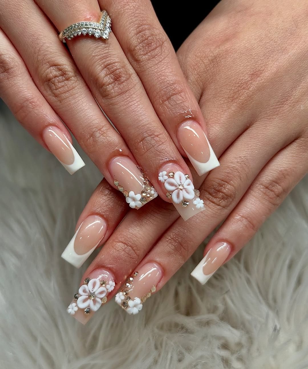 French tip nails with white floral designs