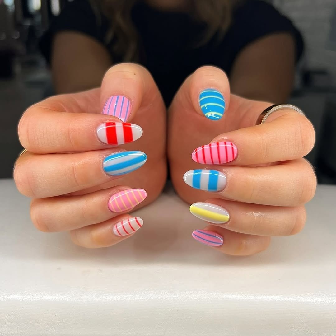 Thin colorful stripes on white nails