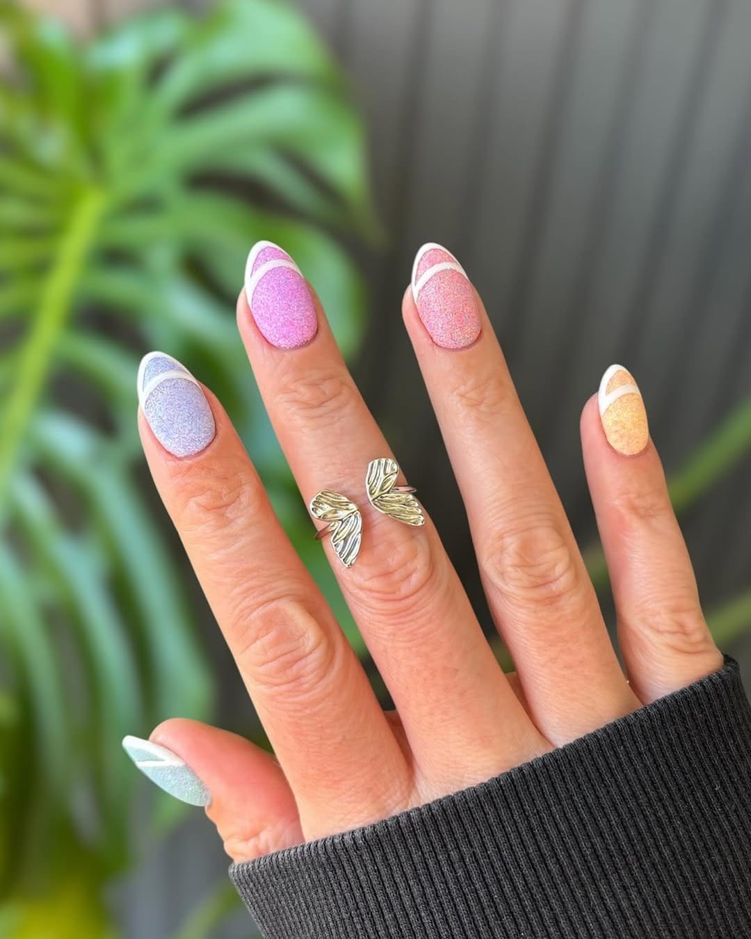 Celebratory pastel pink confetti nail art