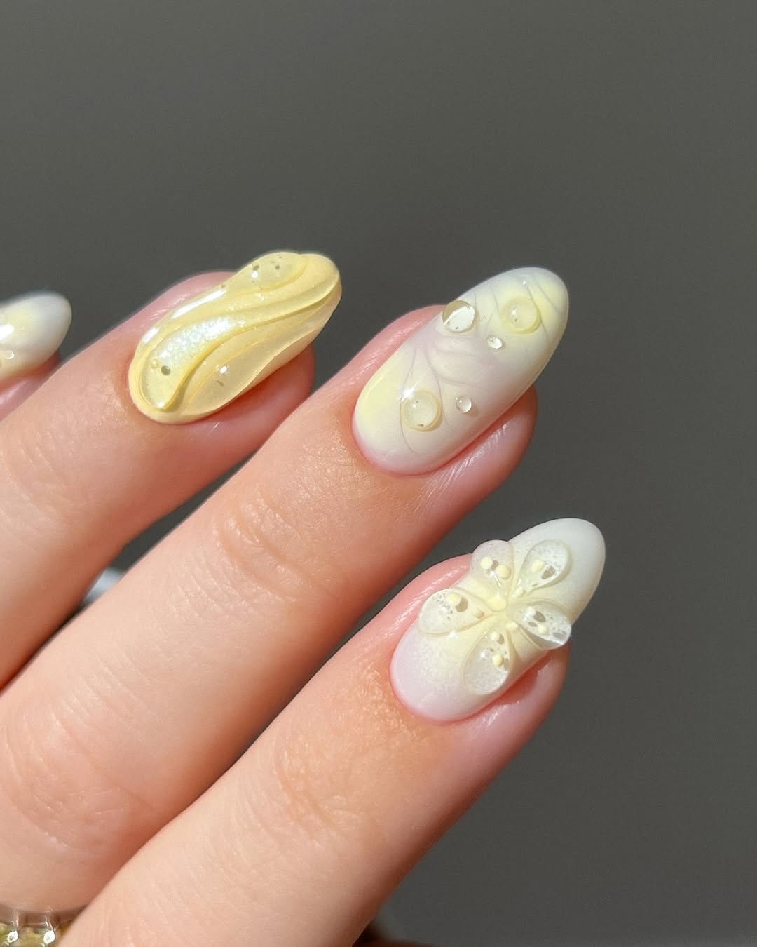 Butter yellow pastel nails with white floral design