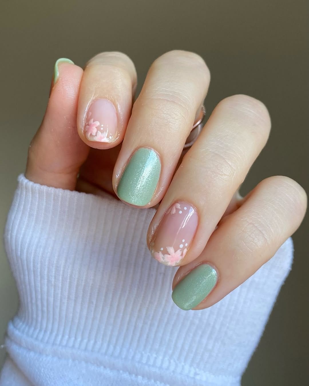 Cherry blossom nail art on pastel background