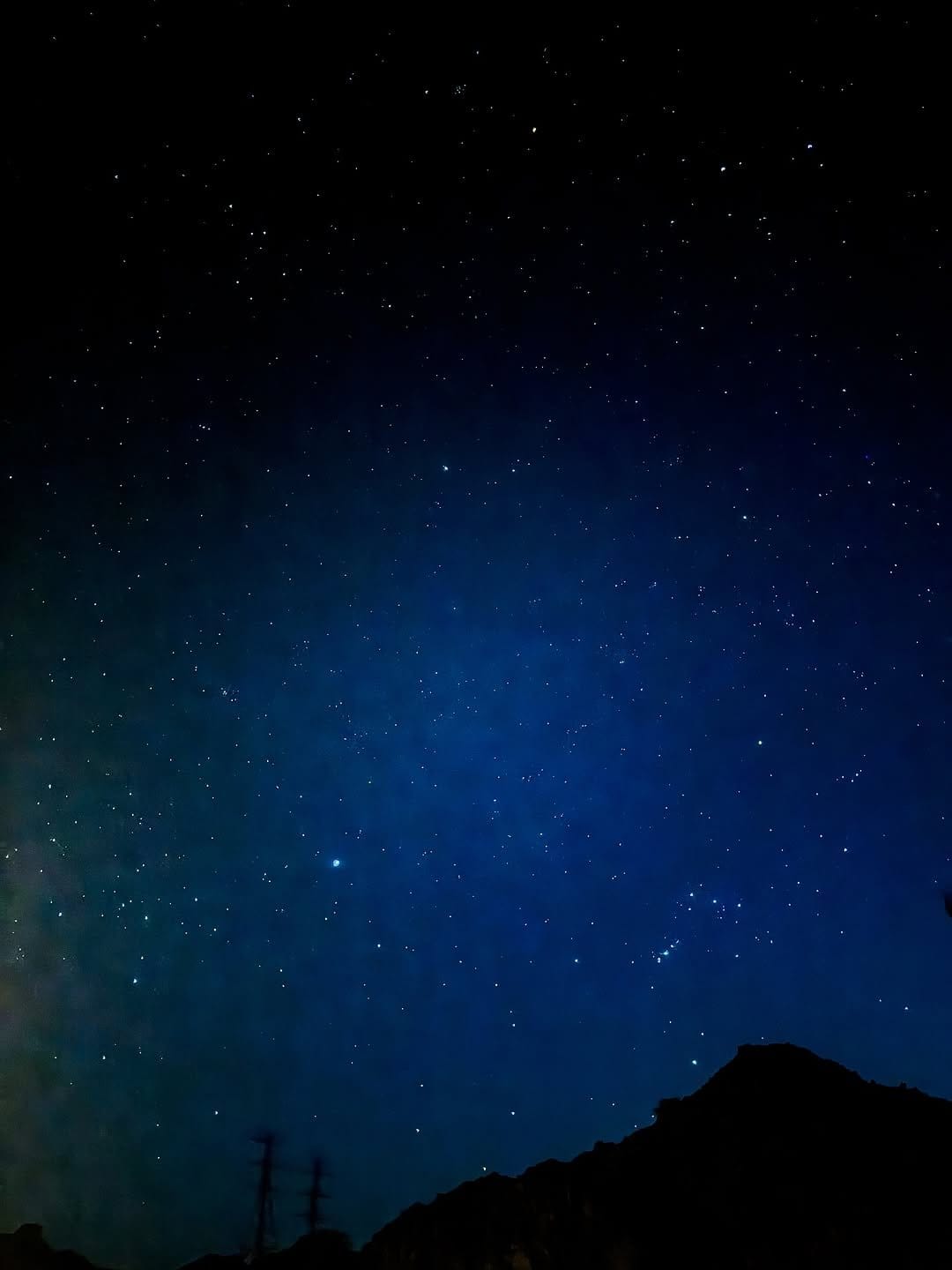 Deep blue lipstick with starry night backdrop