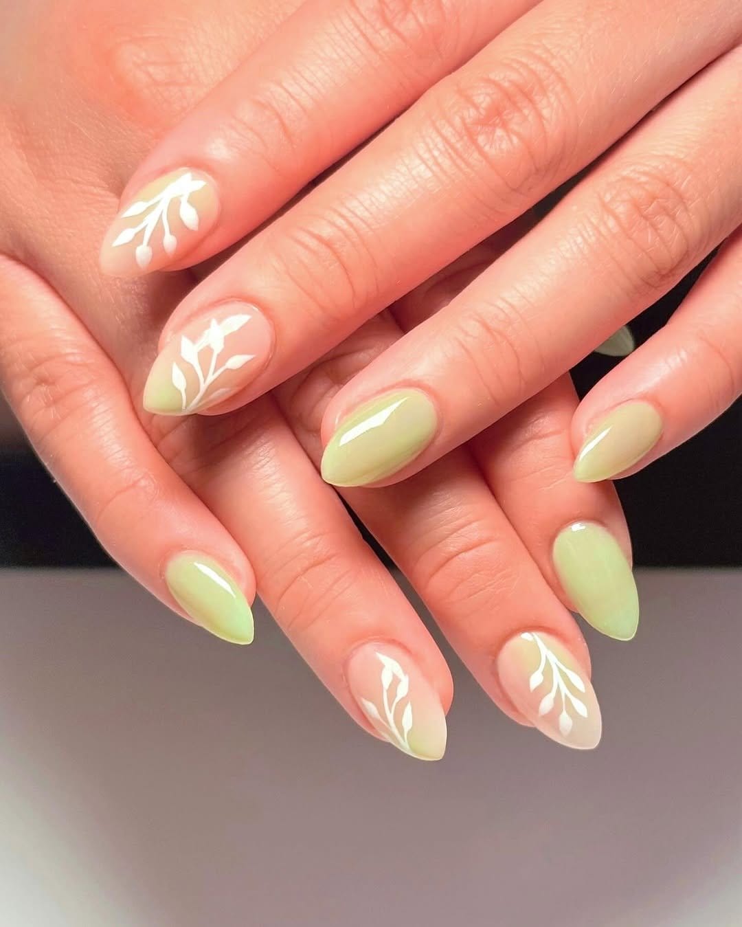 Soft mint green nail polish close-up