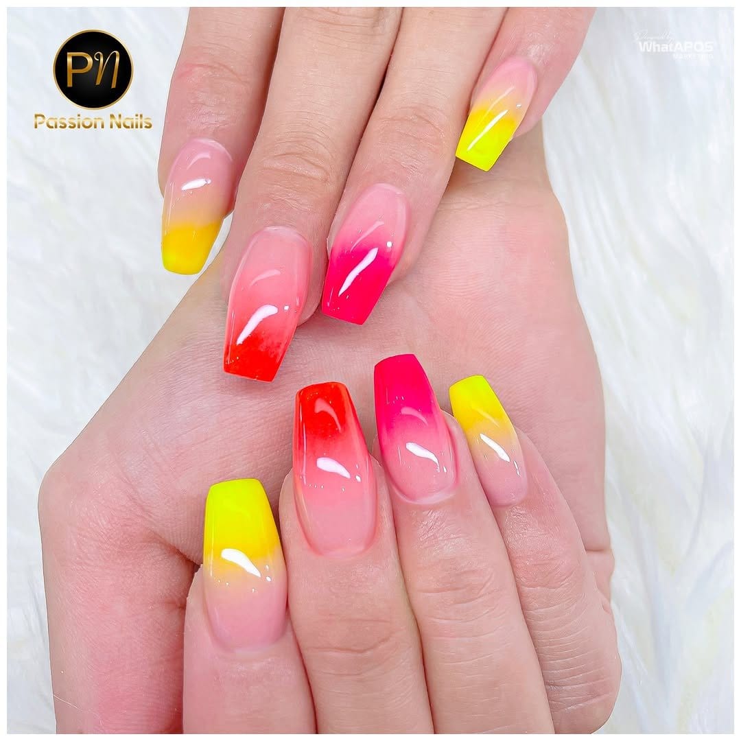 Neon pink ombre nails with vibrant colors