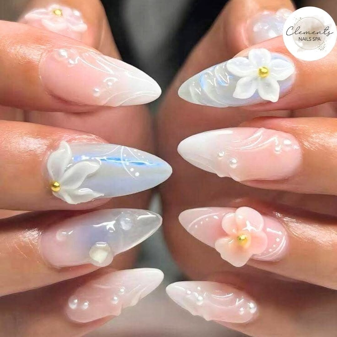 Pastel nails with white floral designs